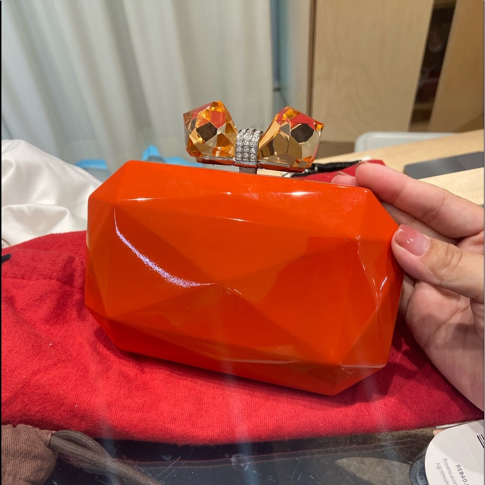 Very cute and stylish clutch with big bow crystal, only corner have scratch!